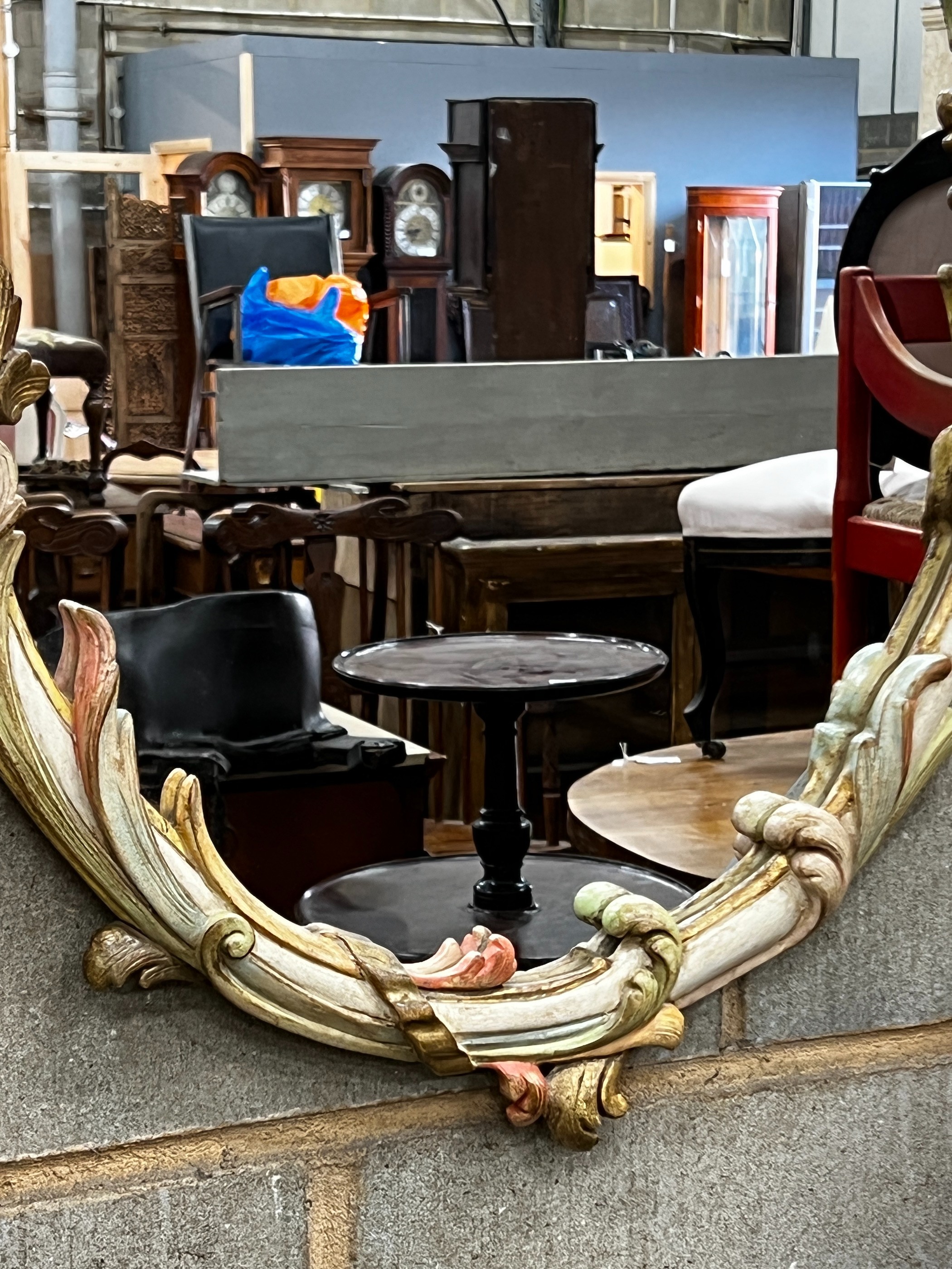 An oval painted frame wall mirror, width 58cm, height 90cm